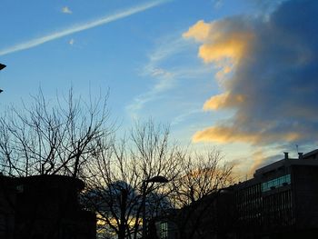 Low angle view of built structure against sky at sunset