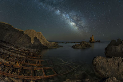 Scenic view of sea against sky at night