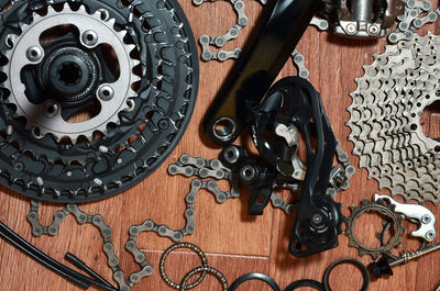 Close-up of bicycle chains and gears on table