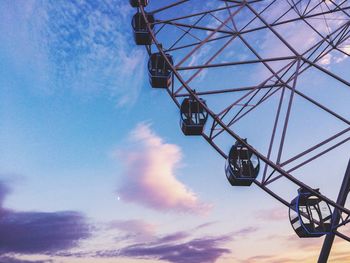 Low angle view of ferris wheel against sky