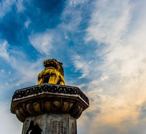 Low angle view of statue against sky