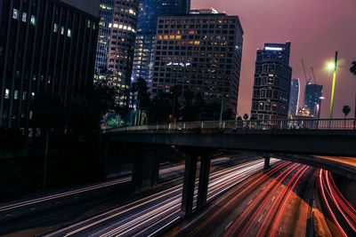 Light trail on highway against sky at night