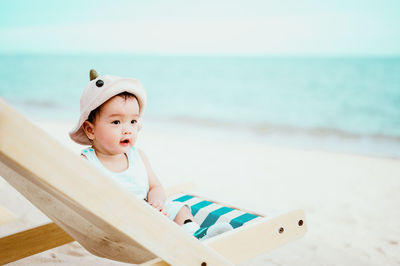 Cute boy looking at beach