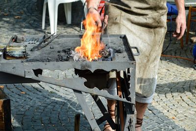 Low section of man wearing shoes