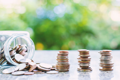 Close-up of stacked coins on table