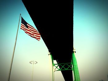 Low angle view of american flag against sky