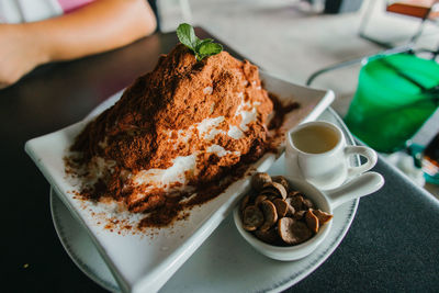 Midsection of woman having breakfast