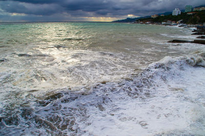 Scenic view of sea against cloudy sky