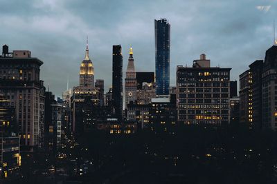 Illuminated buildings in city at night