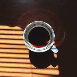 High angle view of black coffee on table