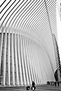 Low angle view of people walking on building