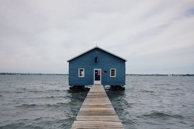 House by sea against sky