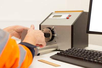 Close-up of man working on laptop