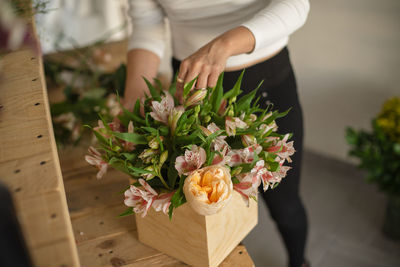 High angle view of woman holding flower bouquet