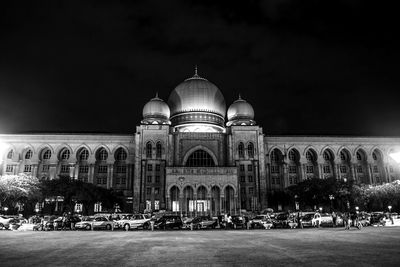 Palace of justice against sky in city at night