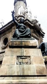 Low angle view of statue against sky