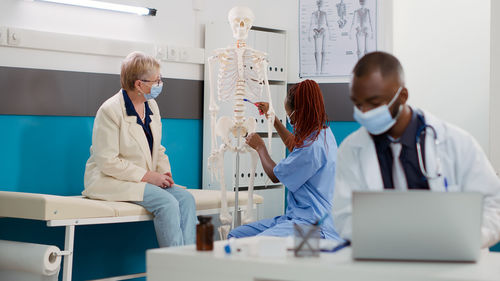 Portrait of female doctor working in office