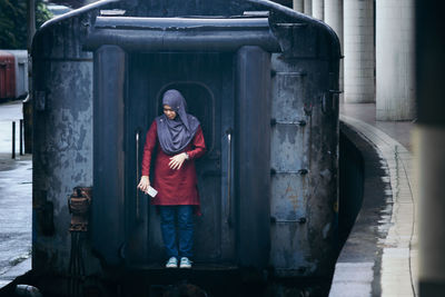 Full length of man standing on railroad track