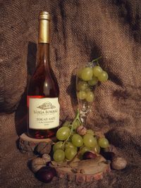 Close-up of wine and bottle in glass