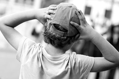 Rear view of boy wearing cap