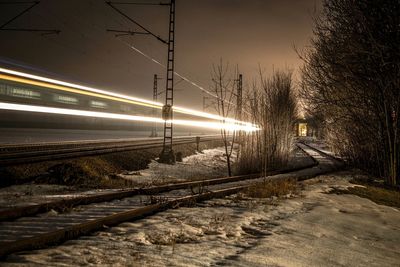 Illuminated bridge at night