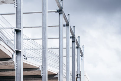 Low angle view of metallic structure against sky