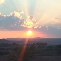 Sun shining over landscape