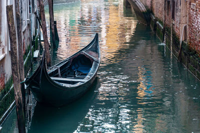 Boats moored in canal