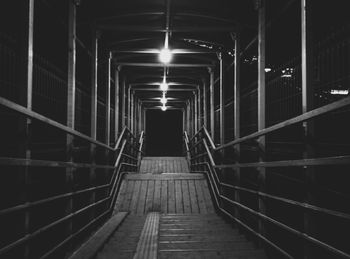 Staircase in illuminated tunnel