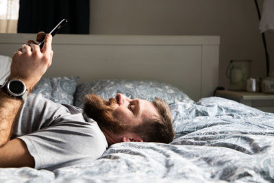 Man lying down on bed