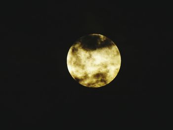 Low angle view of moon in sky at night