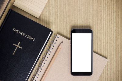 High angle view of smart phone on table