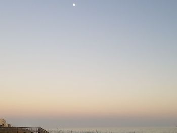 Scenic view of sea against clear sky during sunset