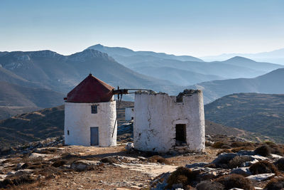 Buildings on mountain against sky