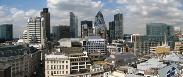 Cityscape against cloudy sky