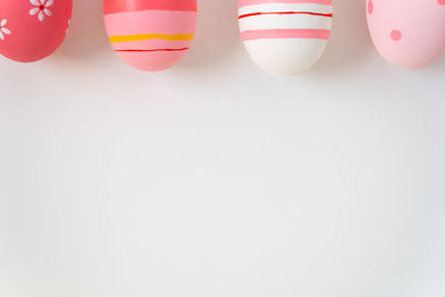 Close-up of multi colored pencils over white background
