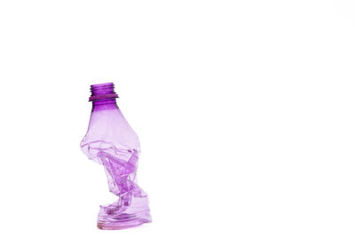 Close-up of glass bottle against white background