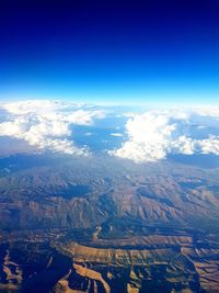 Aerial view of dramatic landscape against sky