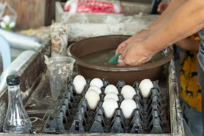 Midsection of person preparing food