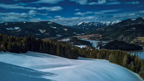 Scenic view of snowcapped mountains against sky