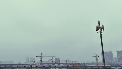 Low angle view of cityscape against clear sky