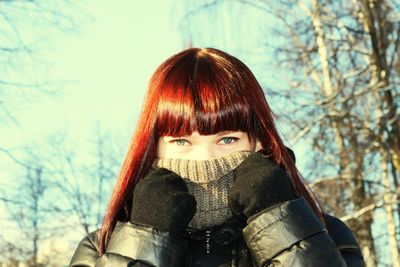 Close-up portrait of woman in snow