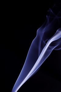 Close-up of blue light against black background