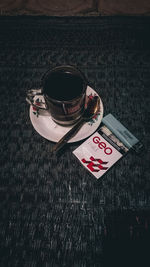 High angle view of coffee cup on table