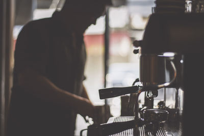 Man working at coffee cup