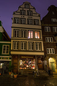 Buildings in city at night