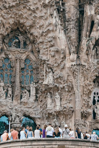 Group of people in front of historic building