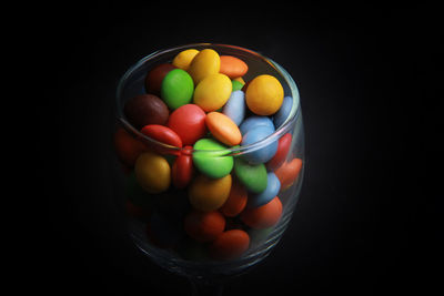 High angle view of multi colored candies in bowl