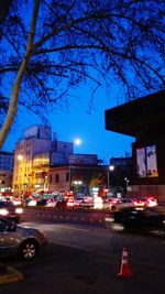 Illuminated city street at night