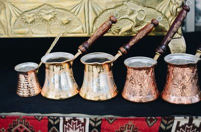 Close-up of old objects for sale at market stall